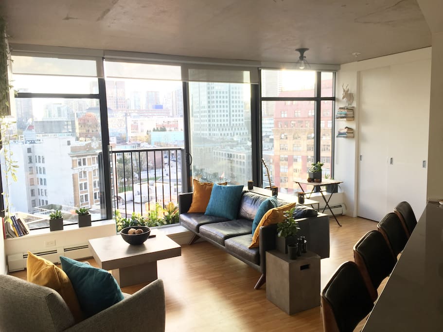 Living room, with kitchen bar stools.