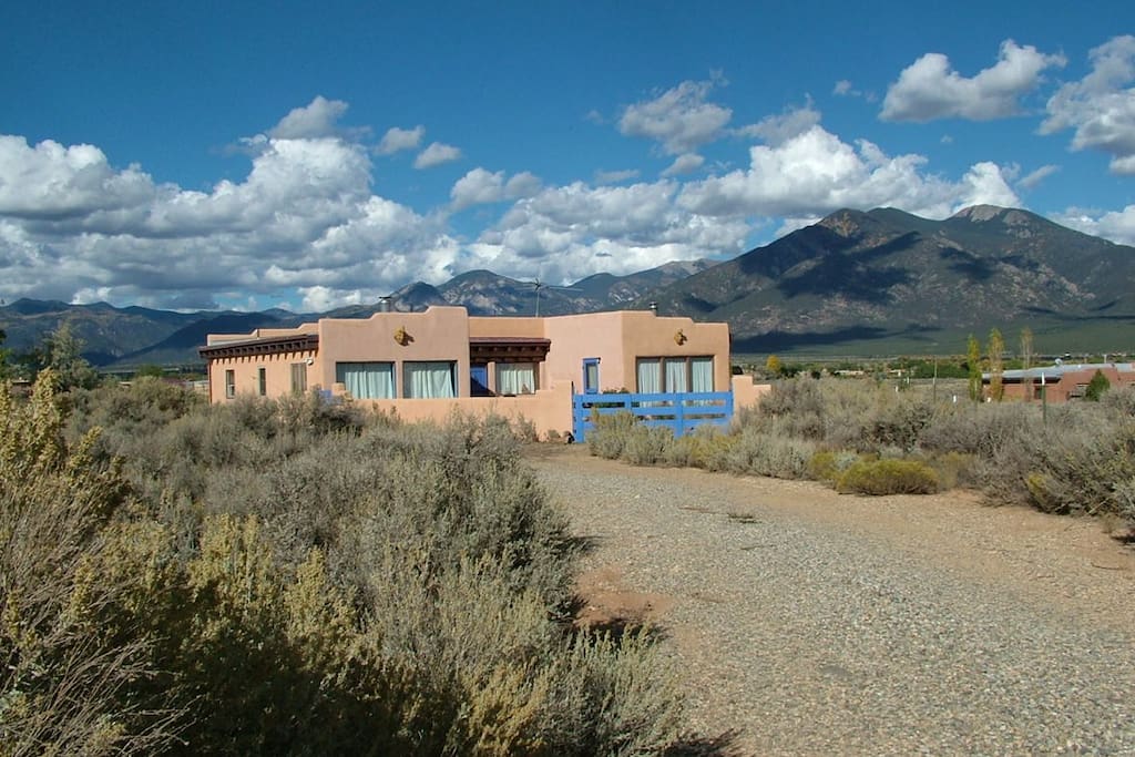 Nestled in the Sangre de Cristo Mountain range with panoramic views, this 2BR adobe-style home provides ample space to sprawl out and relax.