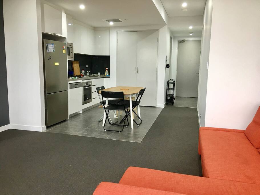 New Samsung fridge. Integrated dishwasher. Microwave. Oven. Gas stovetop. Glass splashbacks and stone benchtop. Polyurethane cabinetry and soft-closing drawers convey a premium feel.