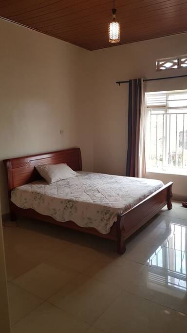 Double Size Bed in bedroom with private bathroom