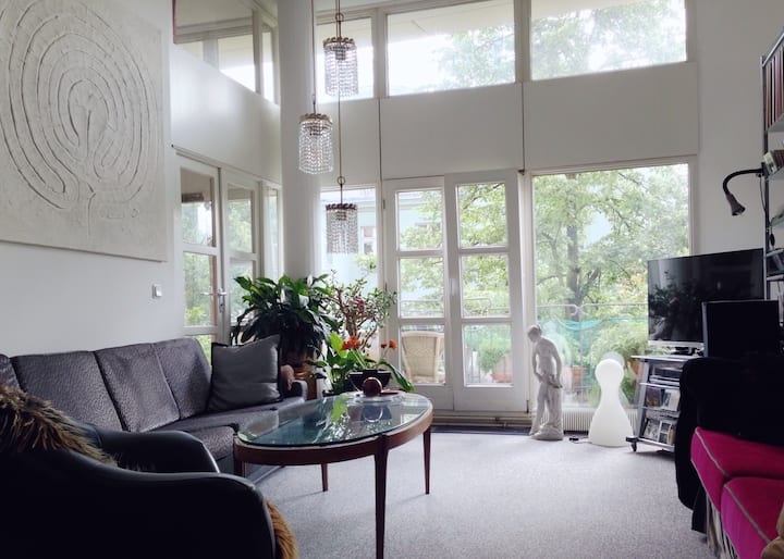 Room with a balcony in a dreamlike neighbourhood