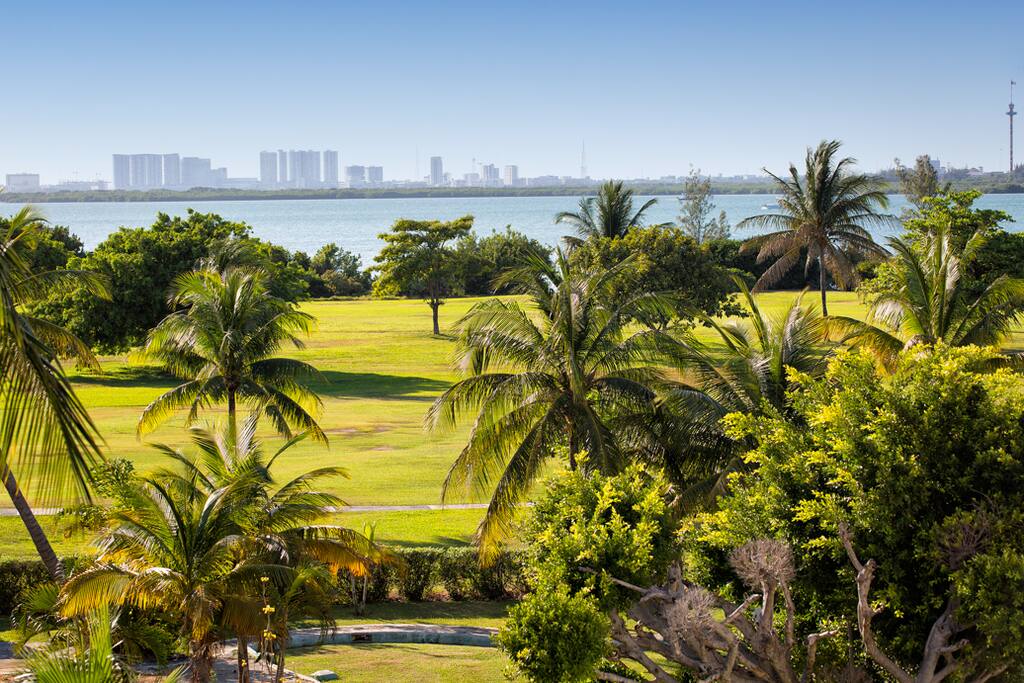 Sweeping views of the Pok Ta Pok Golf course and Nichupte Lagoon from the living room and master bedroom balconies