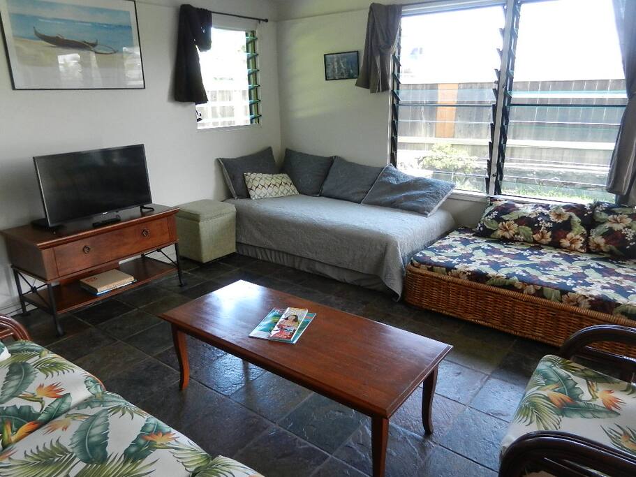 The living room has two twin beds.