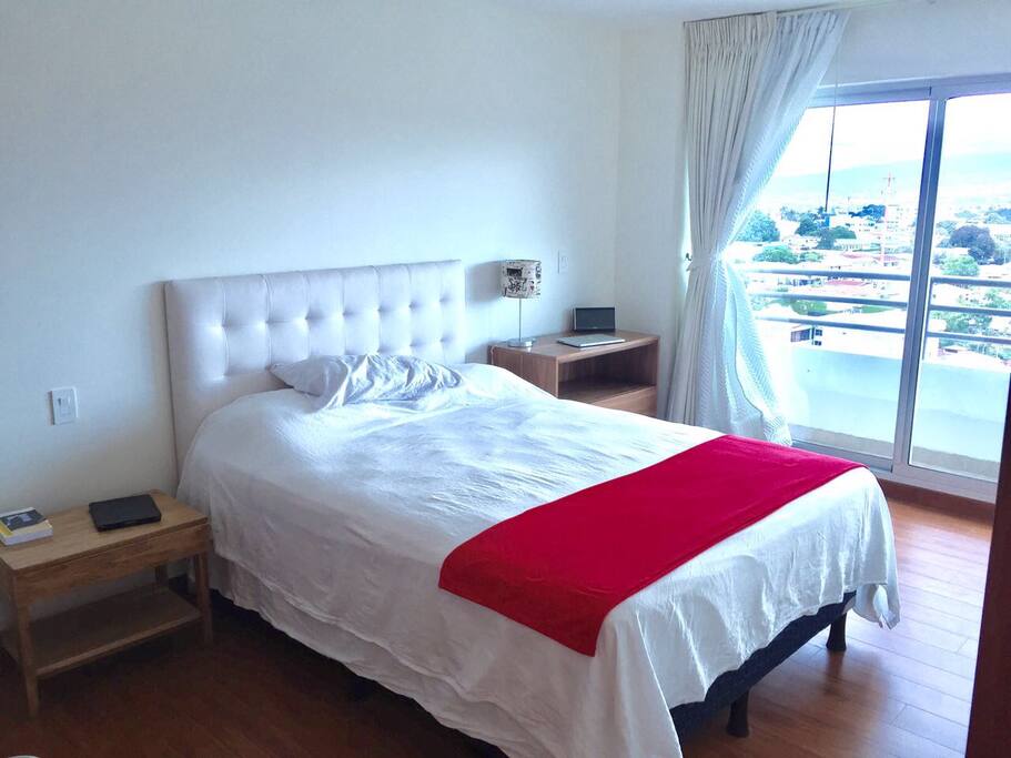 Main room, with balcony and ensuite toilet with shower