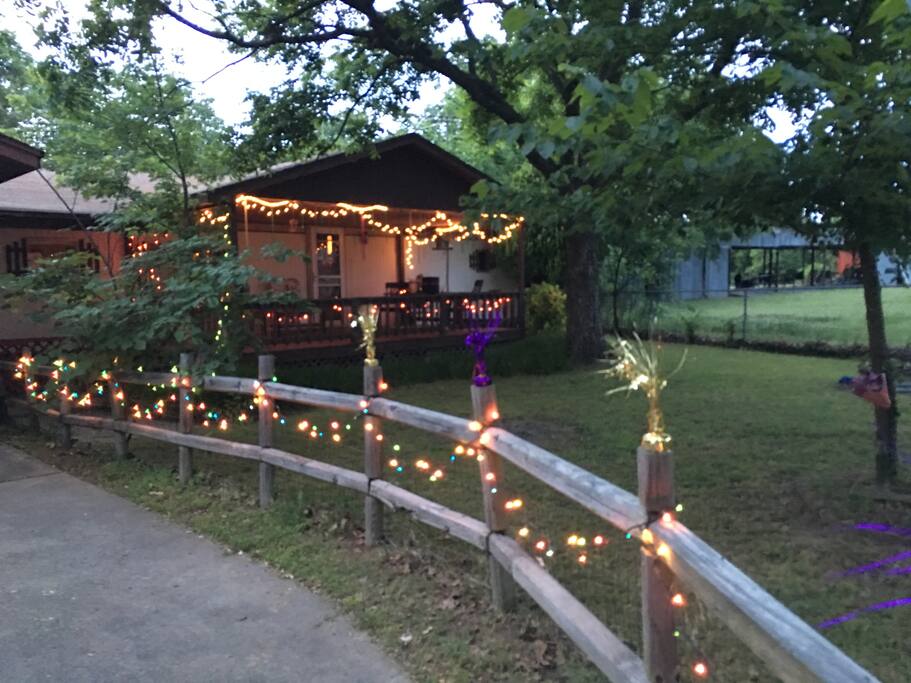 Extra large covered front porch & fenced front yard