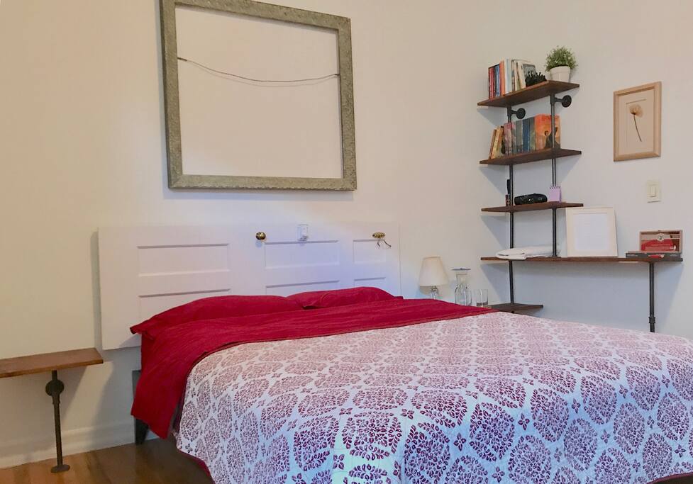 Lovingly decorated with handmade shelving and bedside tables