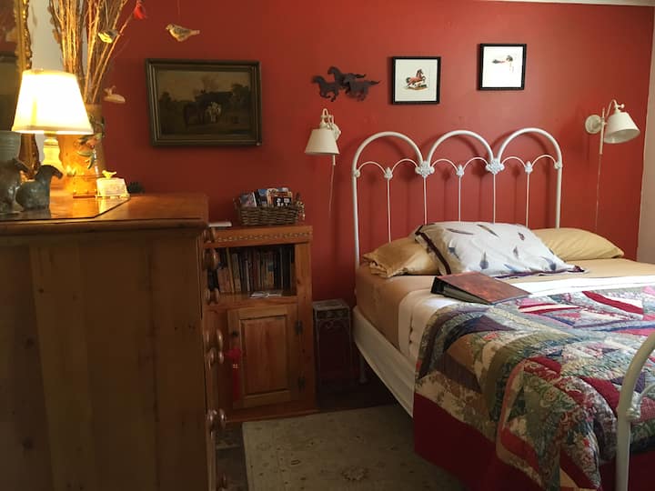 Your comfortable bedroom has a 'western horse' theme.
