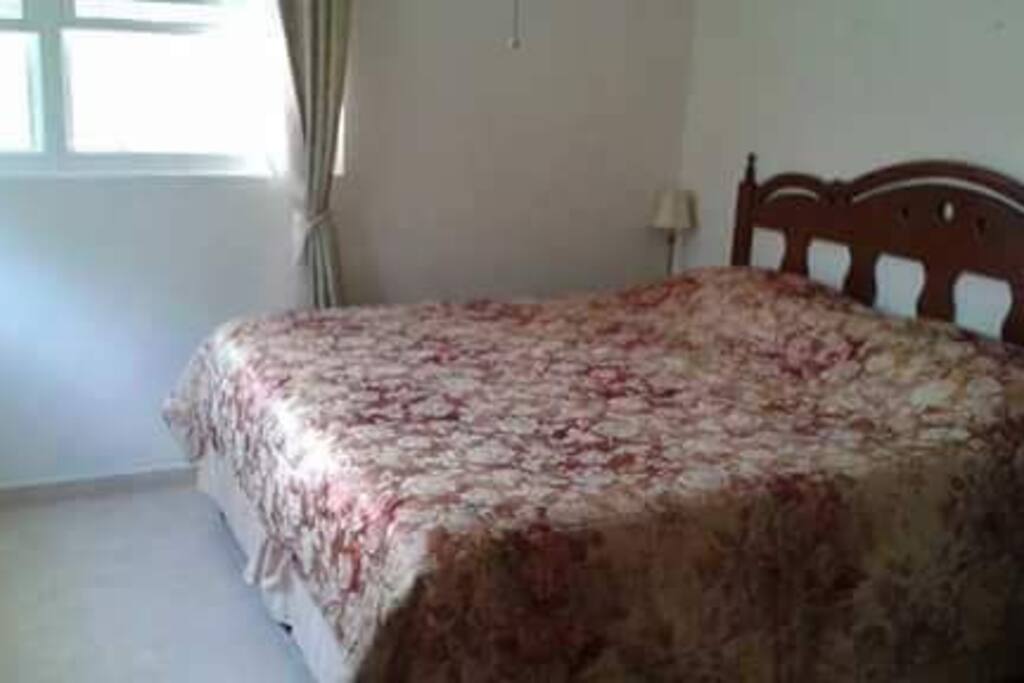 Master bedroom king size bed . ensuite toilet and bath.. Air-conditioning.celing fan.. wardrobe. hangers.