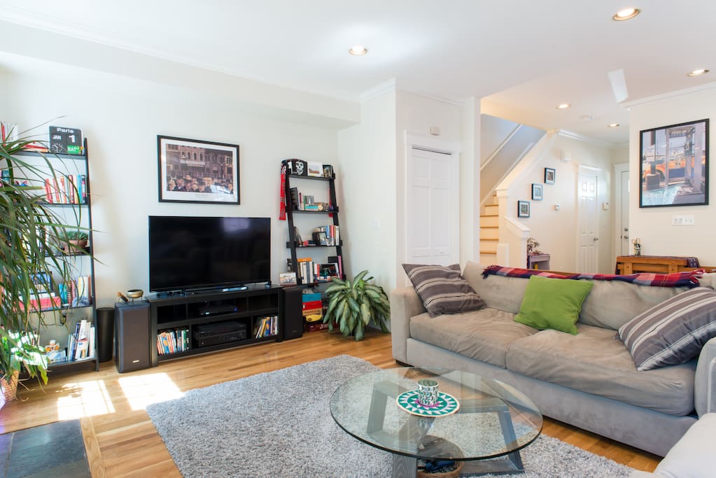 The wide screen TV is connected to cable, AppleTV and Roku.
