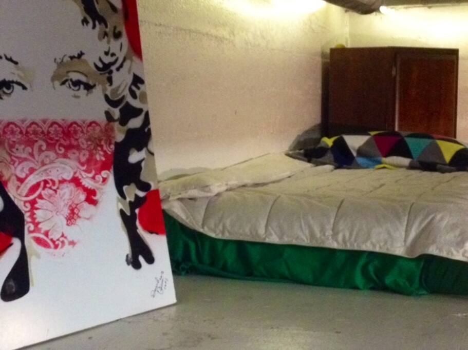 Shared Hostel 6 beds, one couch, lots of storage, and a TV.
