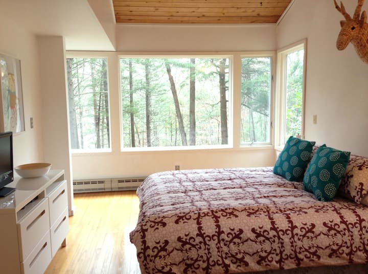 Master Bedroom. There's nothing like sleeping in the trees as the beautiful sounds of the rippling stream lull you to sleep.