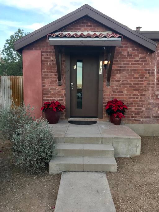 The guest house is located behind this charming main house built in 1937.