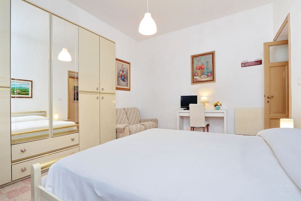 Two comfortable bedrooms are on hand for a peaceful night’s sleep, each fitted with tasteful wall hangings, a flatscreen TV, storage cupboards and a double bed