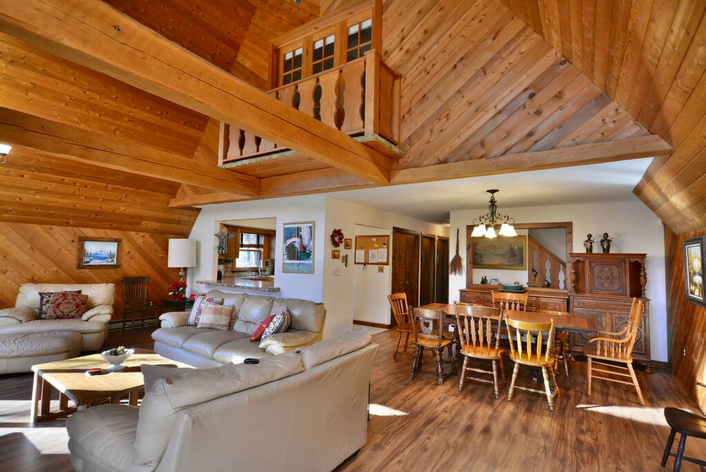 View of dining room, living room, kitchen, and Juliette balcony