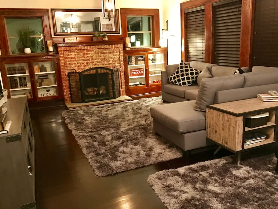 Cozy living room with TV, wifi, book cases and comfortable seating.
