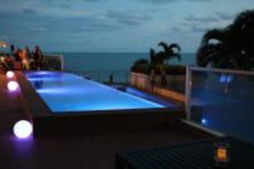 Night view of the pool and beach