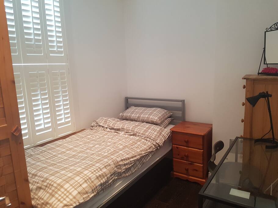 Bedroom with blacked out blinds.