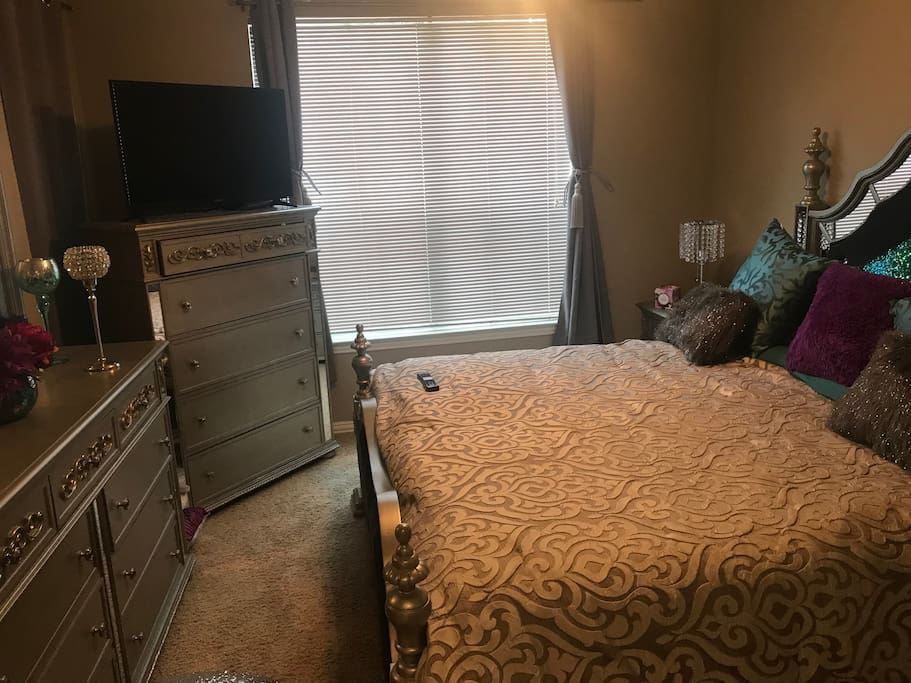King size bed with black out curtains.