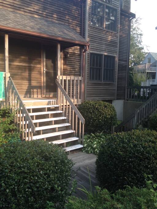 Front door with steps leading to main floor and entrance.