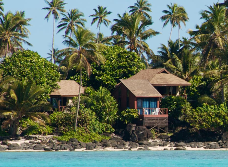From the lagoon looking in @ Muri Beach Cottages with the Pole House in front