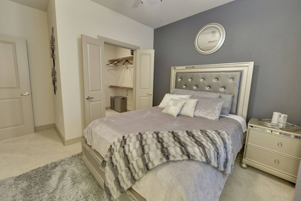 Bedroom 1~ Hollywood style furniture with memory foam topper and West Elm bedding for a relaxing nights sleep. This room has a large master bath attached. Top of the line room with your comfort in mind.