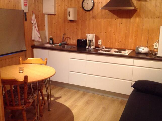 The cottage minute away the black sand beach.