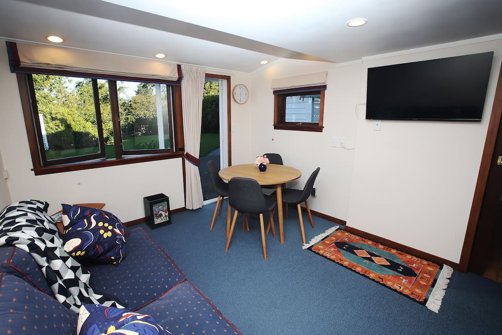 Comfortable living/dining space opening onto private garden.