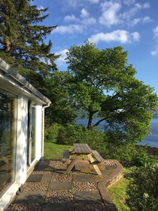 Terrace with picnic table, perfect spot for lunch on fine days.