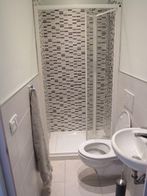 The bathroom and everything you need (towels, shampoo, etc.) is inside the room.