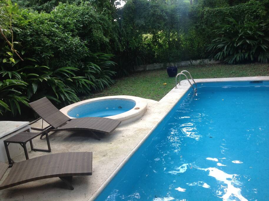 A view of the outdoor jacuzzi by swimming poole