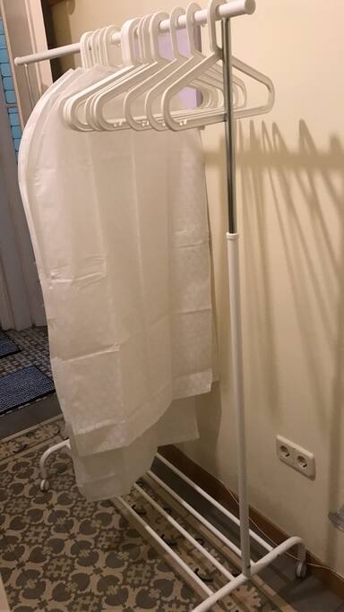 Hangers and a rack to keep your clothes organized. (No wardrobe, sorry!).