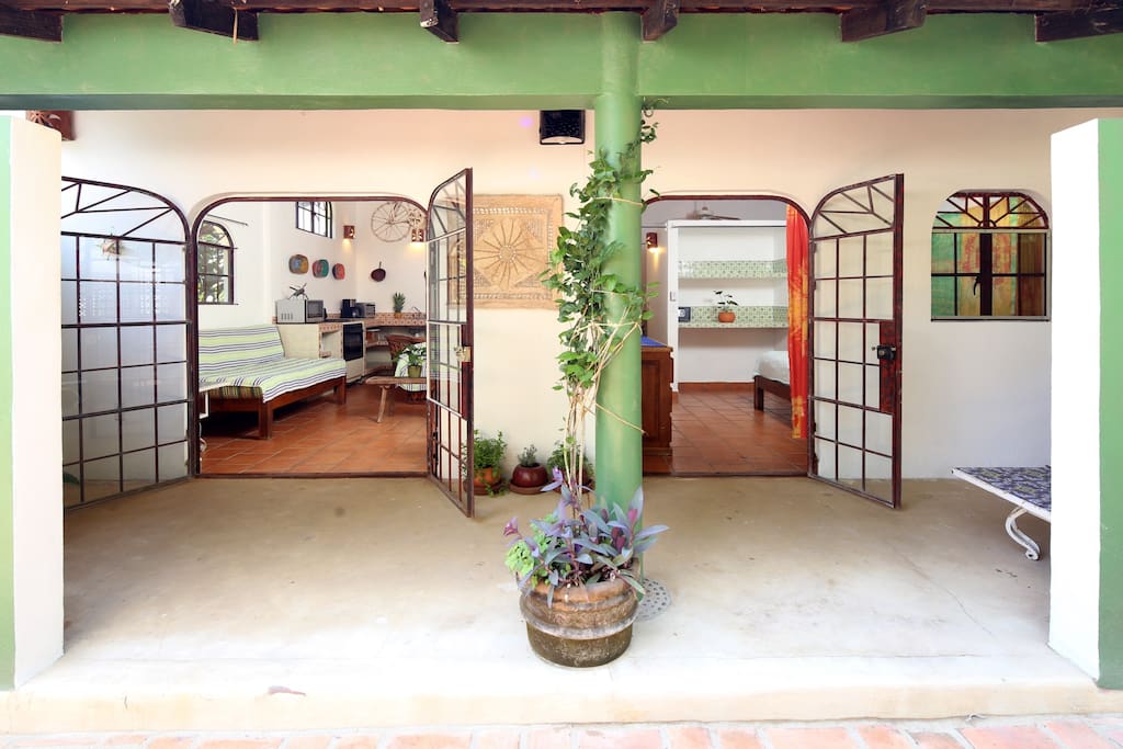 Living area and bedroom open to your private courtyard