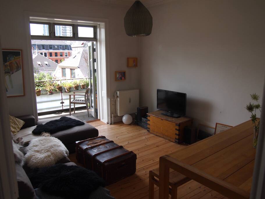 Sitting room with table and benches.
