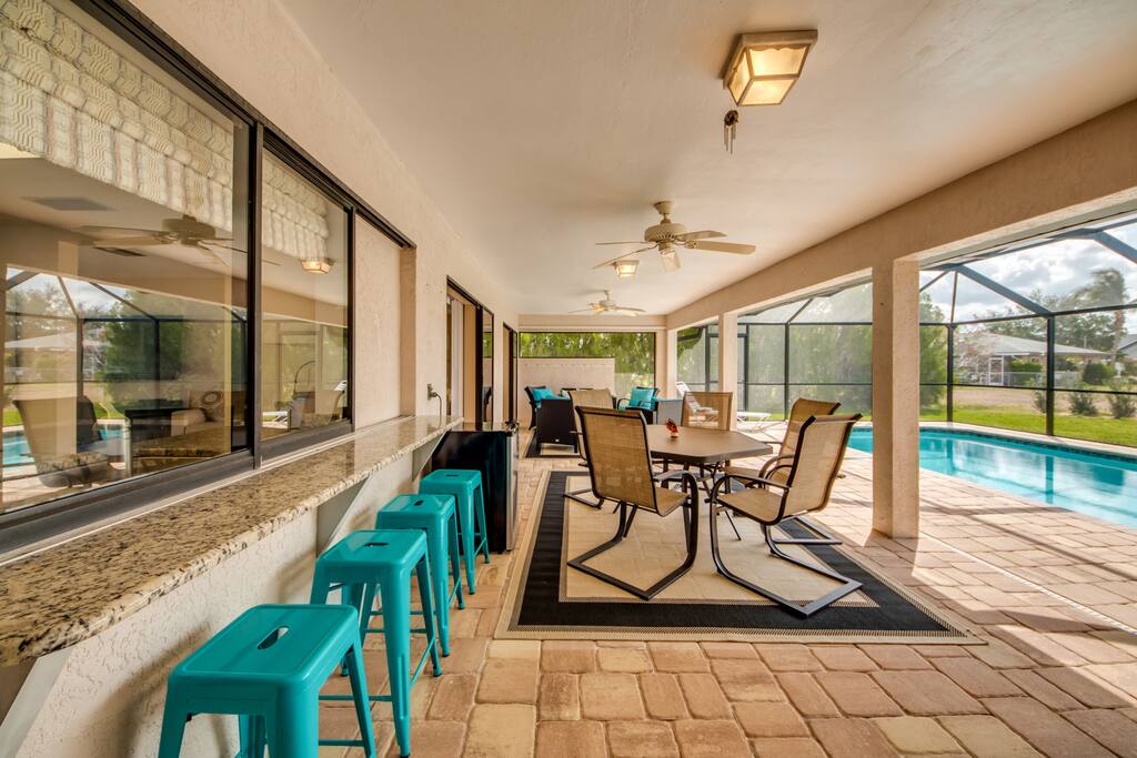 Lanai bar opens to kitchen.
