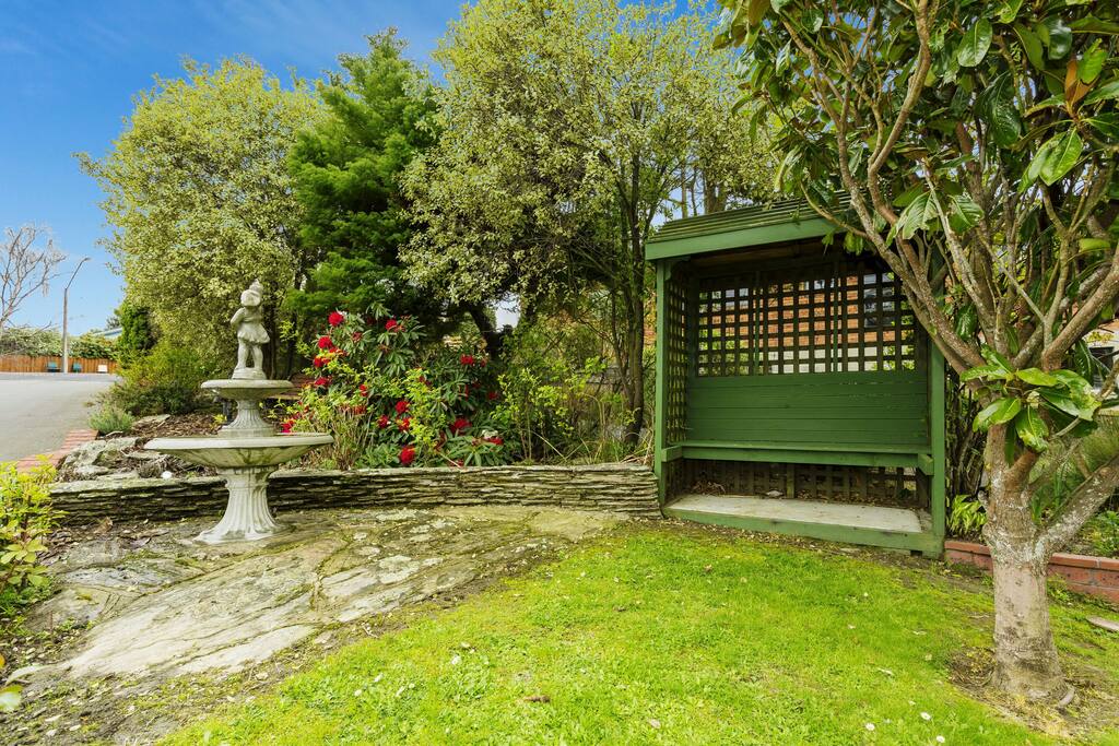 Front yard garden with fountain and gazebo