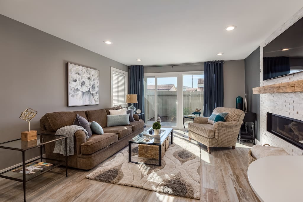 Living room with sliding doors to patio. This flat is on East Cliff drive, a half a block from the stairs to Pleasure Point beaches.