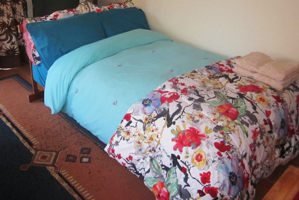 Bedroom 2: sofa bed. Curtains, blinds and rugs make the space cosy, warm, give you privacy and make it dark for sleeping.