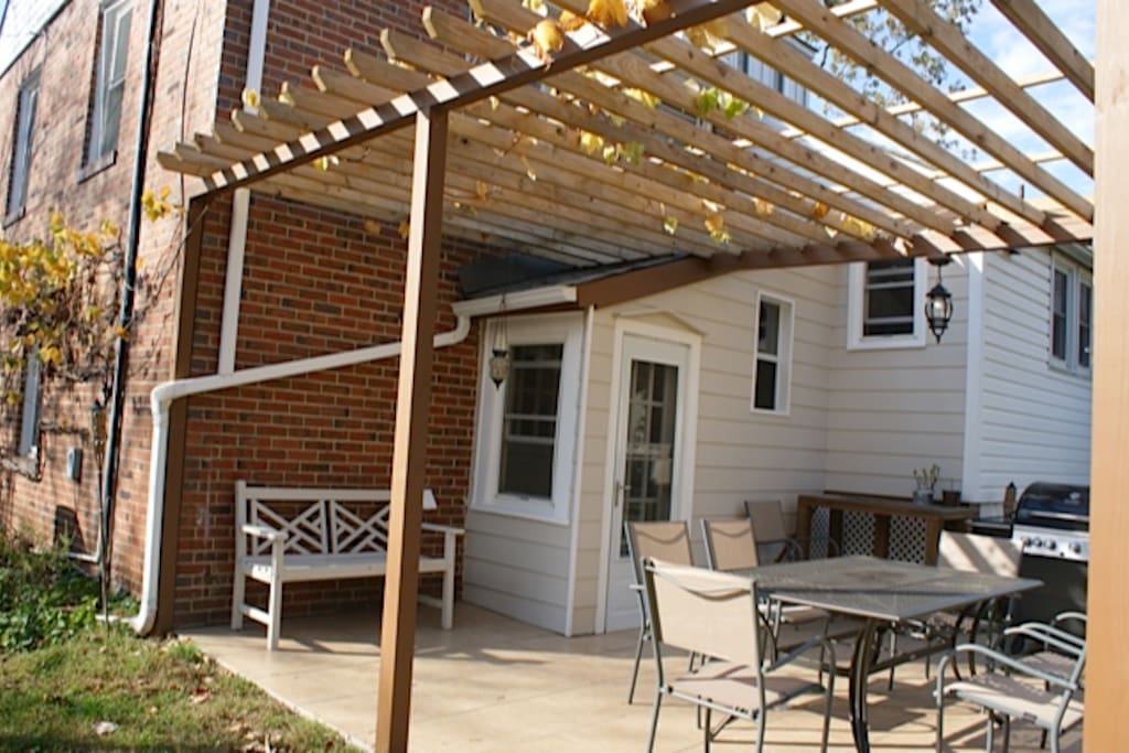 Outdoor patio/pergola includes table, chairs, and propane gas BBQ grill!