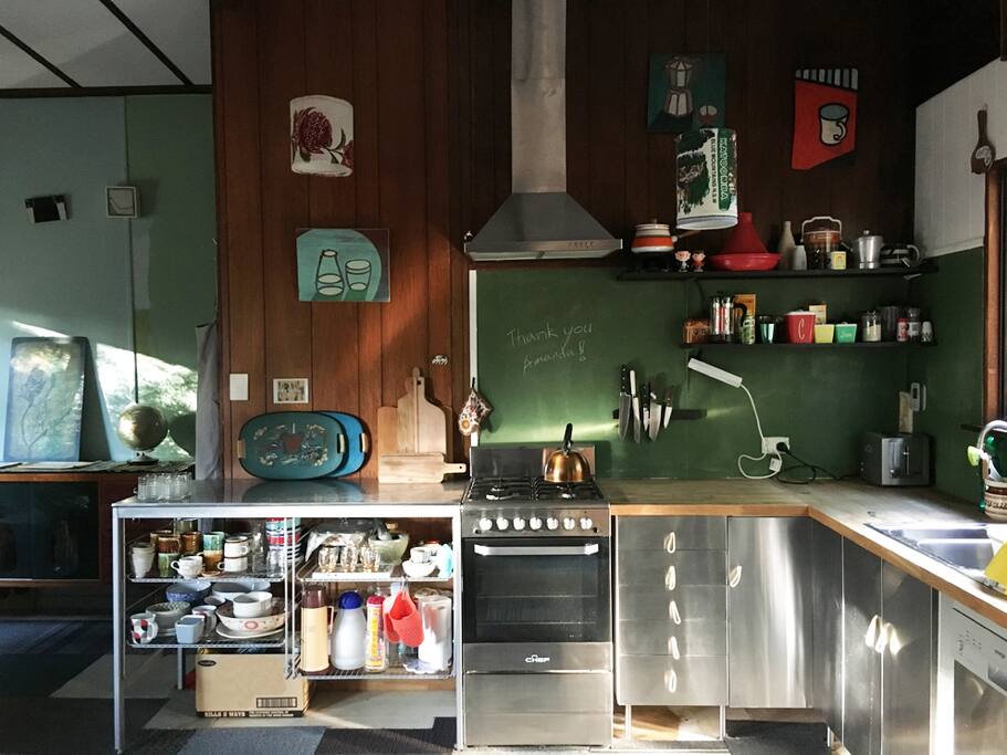 Nifty stainless steel kitchen with gas oven and range. She's small but she's got everything you need.
