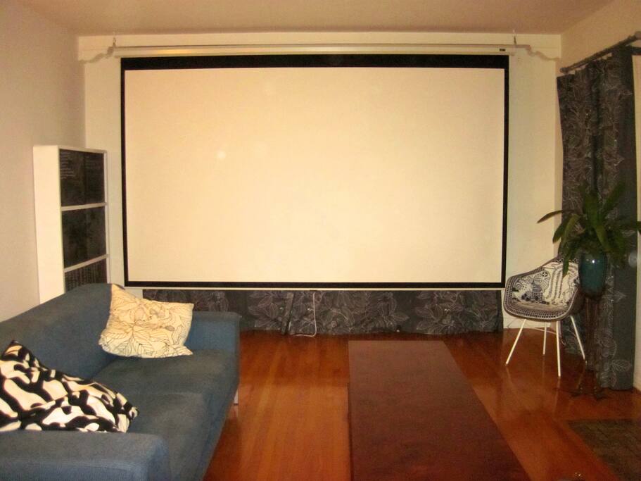 Just close the curtains and pull down the retractable screen.