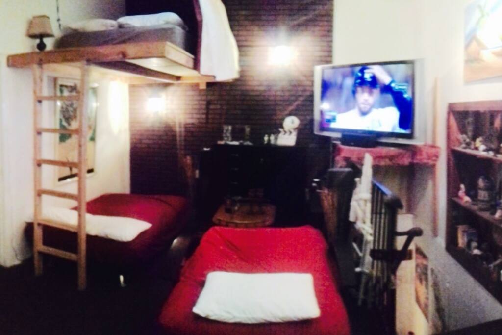 It opens up to 3 beds for your party to sleep on. A double loft bed, a double futon and a single futon.