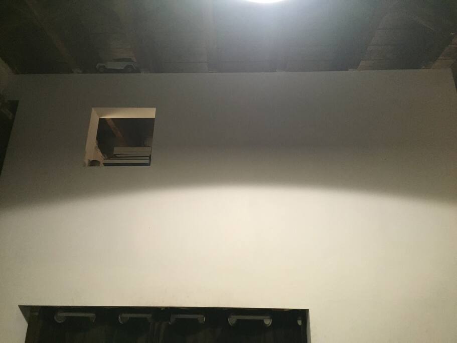 Above the nook is a loft with the main bed.