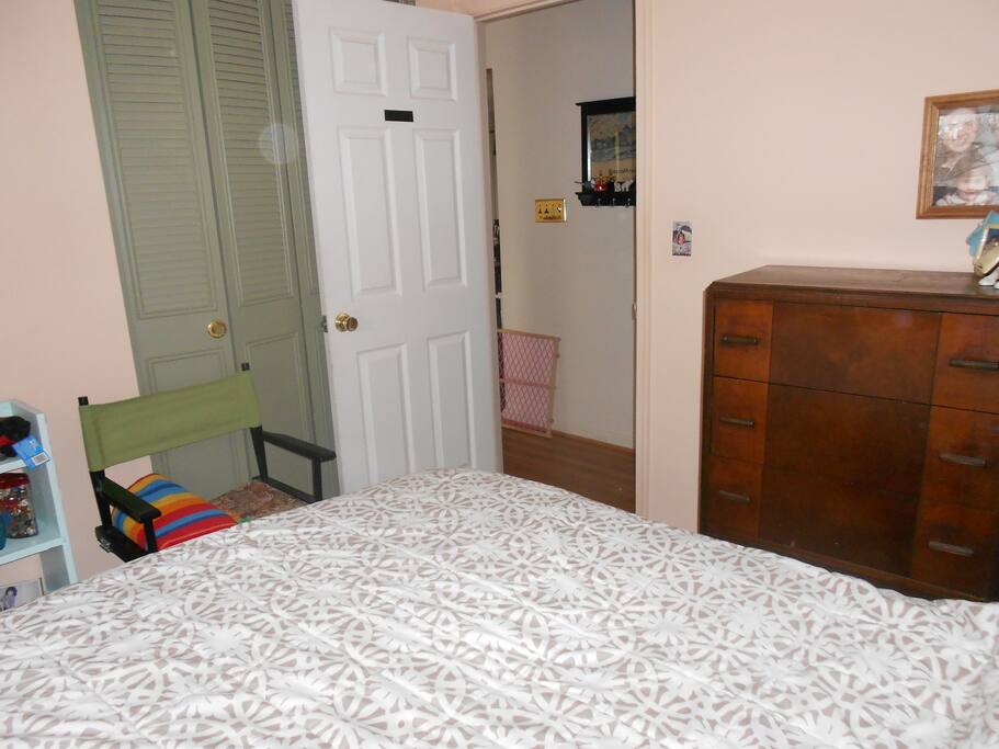 chair, louvered doors to closet, door to hallway, connects to bath (R) and kitchen