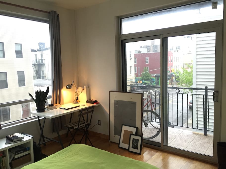 The bedroom and balcony access