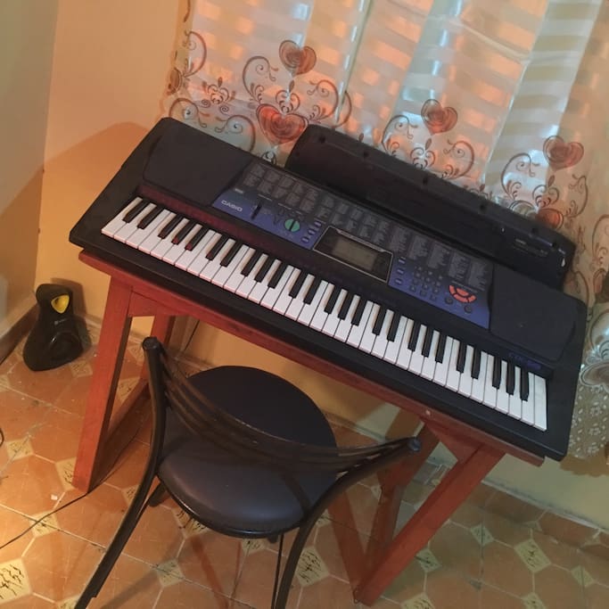 A keyboard piano in the house