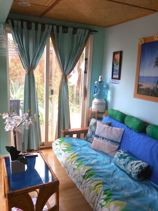 Welcome! Colorful art, Beach inspired colors and decor in this Clean and comfortable tiny house studio. (photo: June 1, 2017).