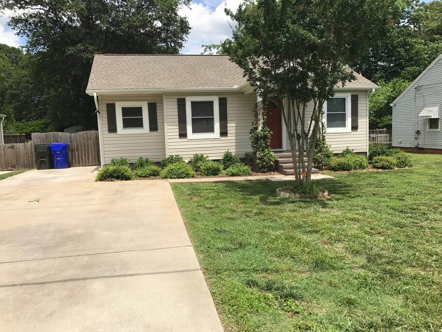 The front yard and double driveway. 3/2. Four steps up to the porch and the front door.