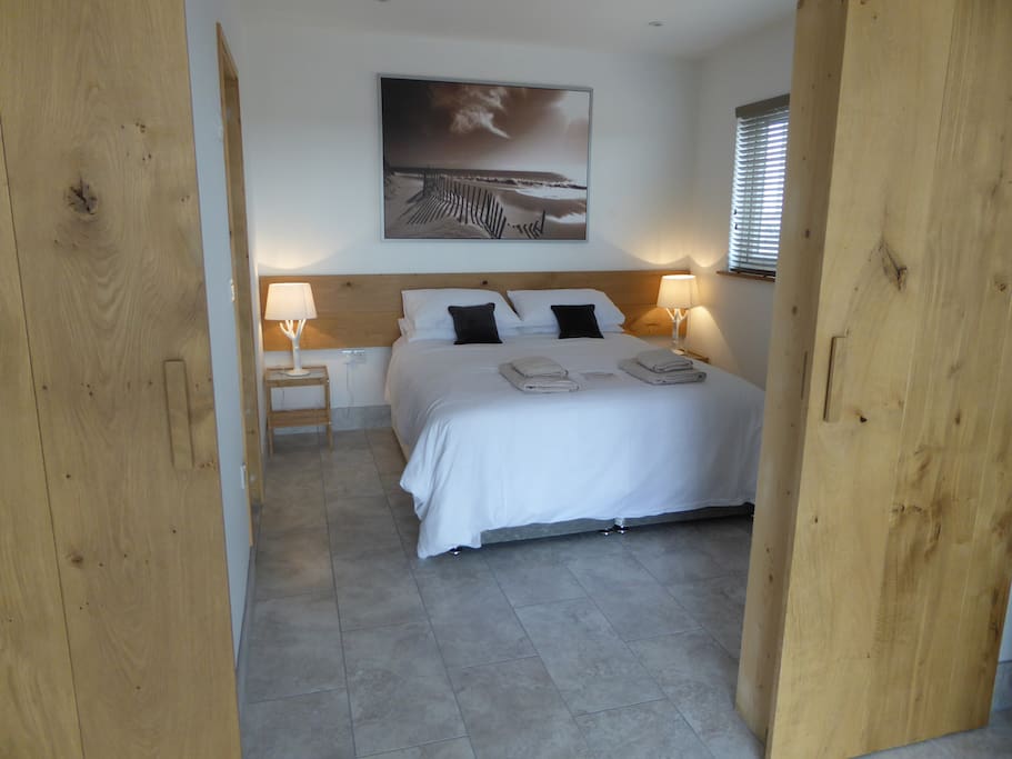 The bedroom with en suite shower room