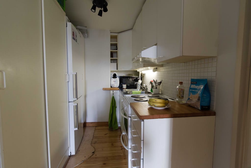 The kitchen area is light and even though it is small, well planned enough to be usable.