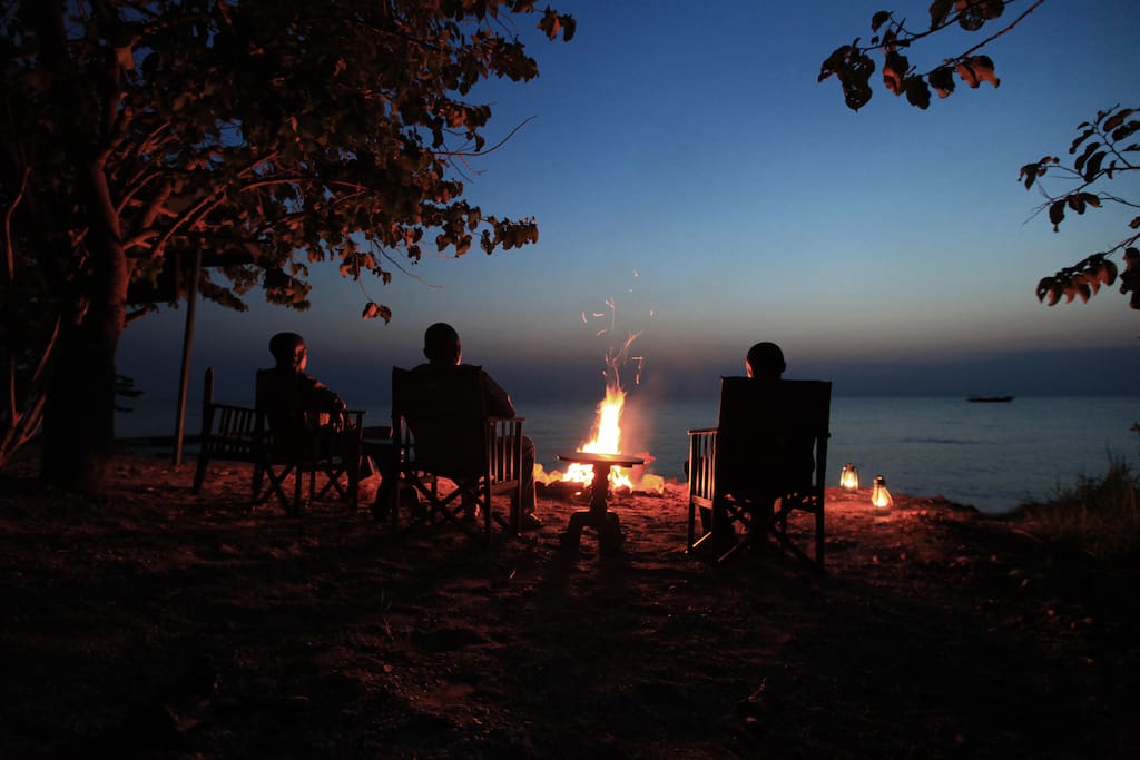 Unwind at our campfire as you watch the sun set over Lake Tanganyika